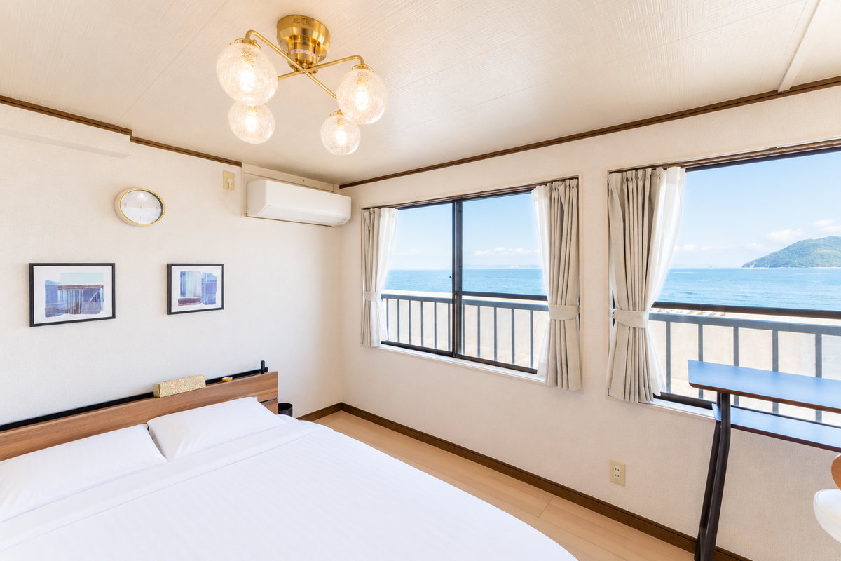 The sea-side windows seen from the bed